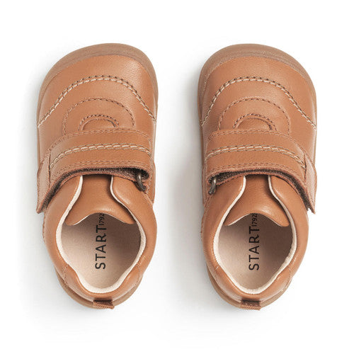 A pair of boys casual shoes by Start-Rite, style Footprint. In tan leather with velcro fastening and toe bumper. Right side view.