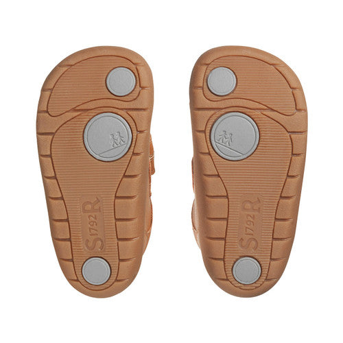 A pair of boys casual shoes by Start-Rite, style Footprint. In tan leather with velcro fastening and toe bumper. View of soles.