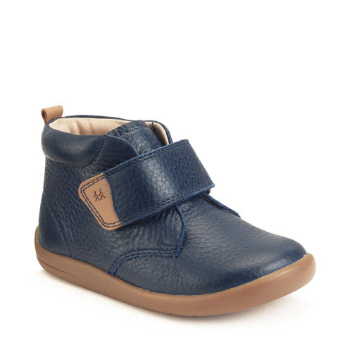 A boys ankle boot by Start-Rite, style Totter, in navy leather with light tan trim and sole unit. Velcro fastening. Angled right side view.
