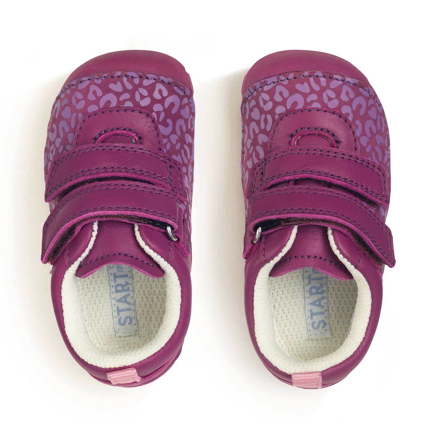 A pair of girls pre-walkers by Start-Rite, style Little Smile. In bright pink nubuck with leopard print detail. Double velcro fastening and toe bumper. Above view.