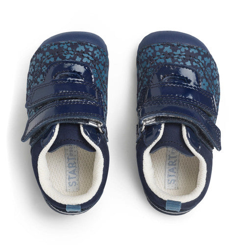 A pair of girls pre-walkers by Start-Rite, style Little Smile. In plain navy and floral print nubuck with patent double velcro fastening and toe bumper. Above view.