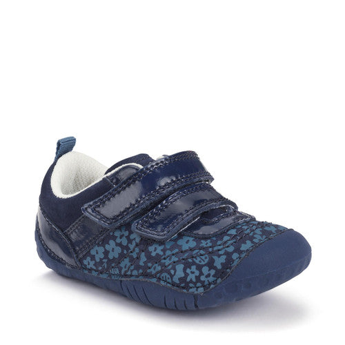A girls pre-walker by Start-Rite, style Little Smile. In plain navy and floral print nubuck with patent double velcro fastening and toe bumper. Angled view.