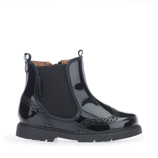 A girls Chelsea boot by Start-Rite, style Chelsea in black patent leather with brogue detail, elastic side panel and zip fastening. Right side view.