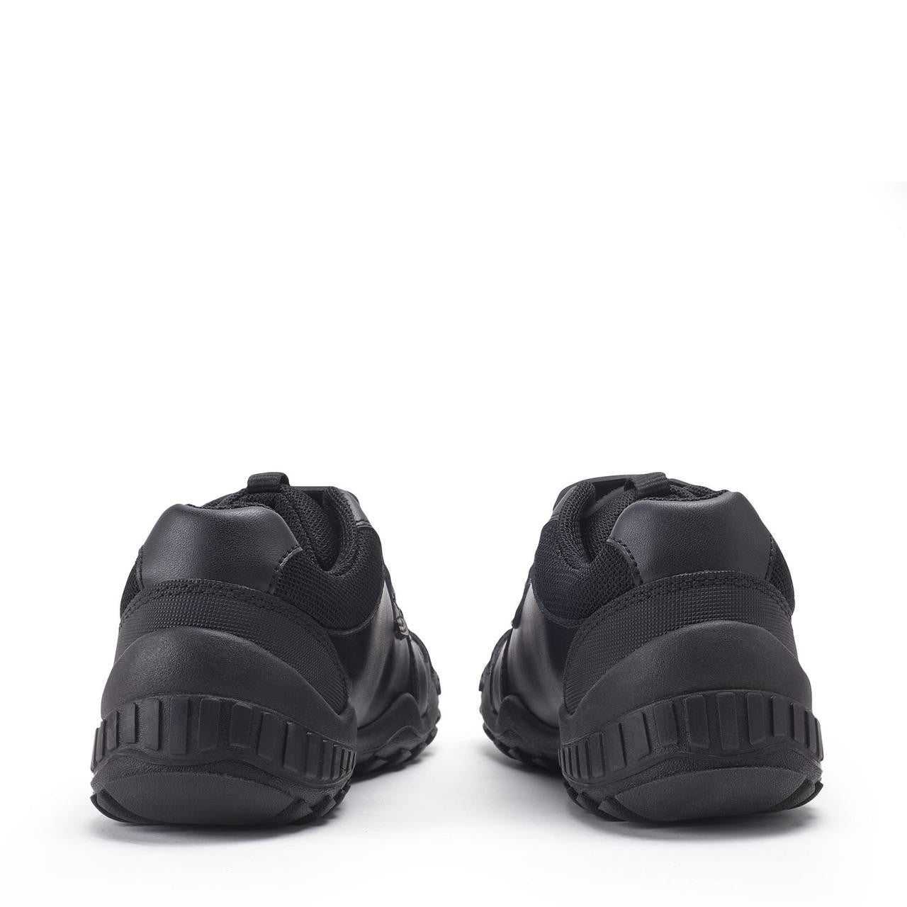 A pair of boys school shoes by Start-Rite, style Rumble in black leather with dino detail and toe, heel and side bumpers. Back view.