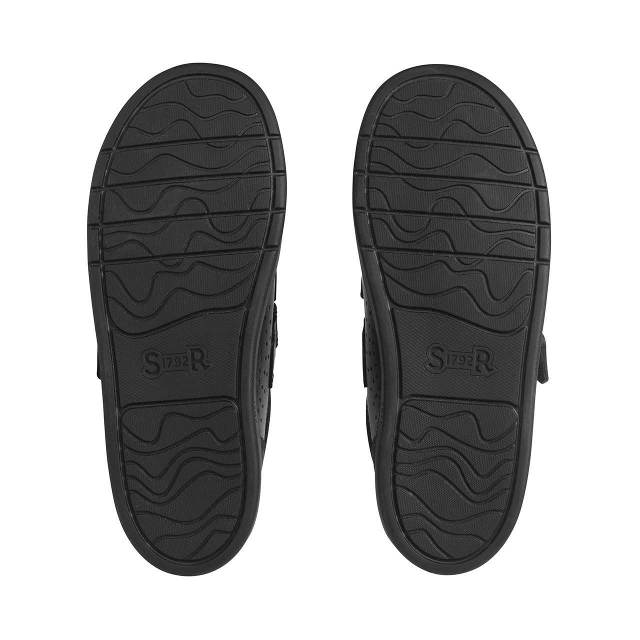 A boys school shoe by Start-Rite, style Spider Web, in black leather with toe bumper and spider motif. View of soles.