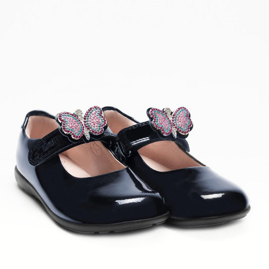 A girls Mary-Jane school shoe by Lelli Kelly, style LKSO8641 Luna 2 in Navy patent leather with velcro fastening and detachable multi coloured embellished butterfly.  Angled right side view of pair.