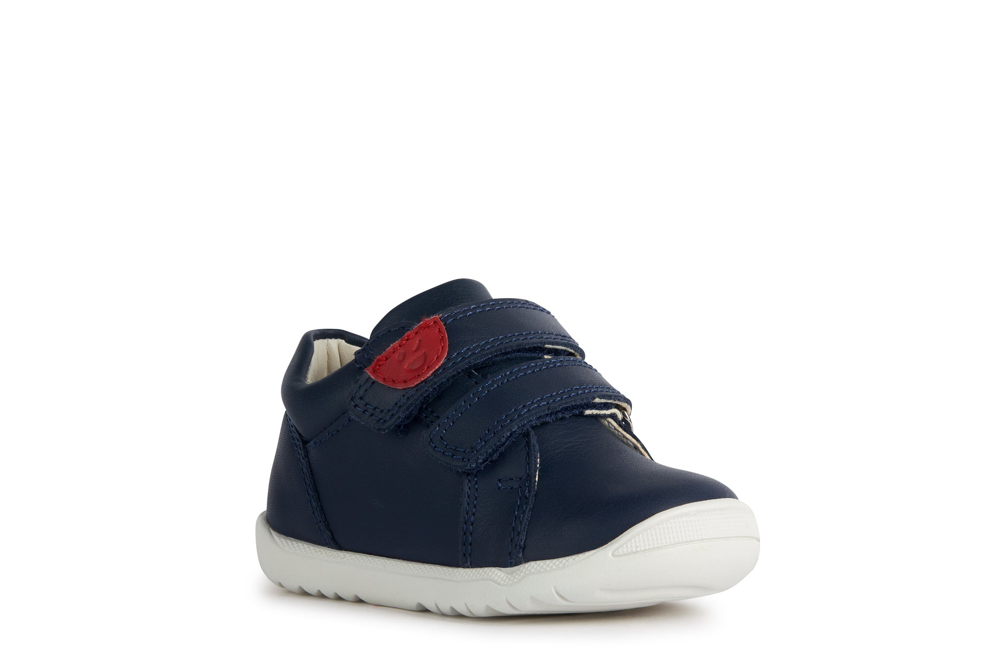 A boys shoe by Geox, style B Macchia, in navy leather with red trim and double velcro fastening. Angled view of right side.