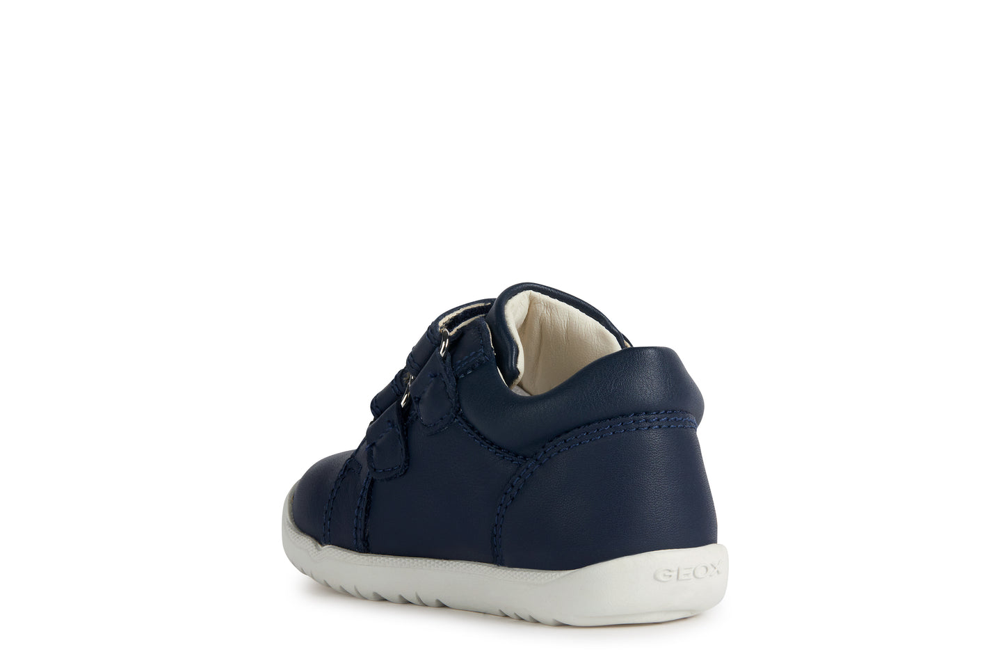 A boys shoe by Geox, style B Macchia, in navy leather with red trim and double velcro fastening. Angled view of left side.