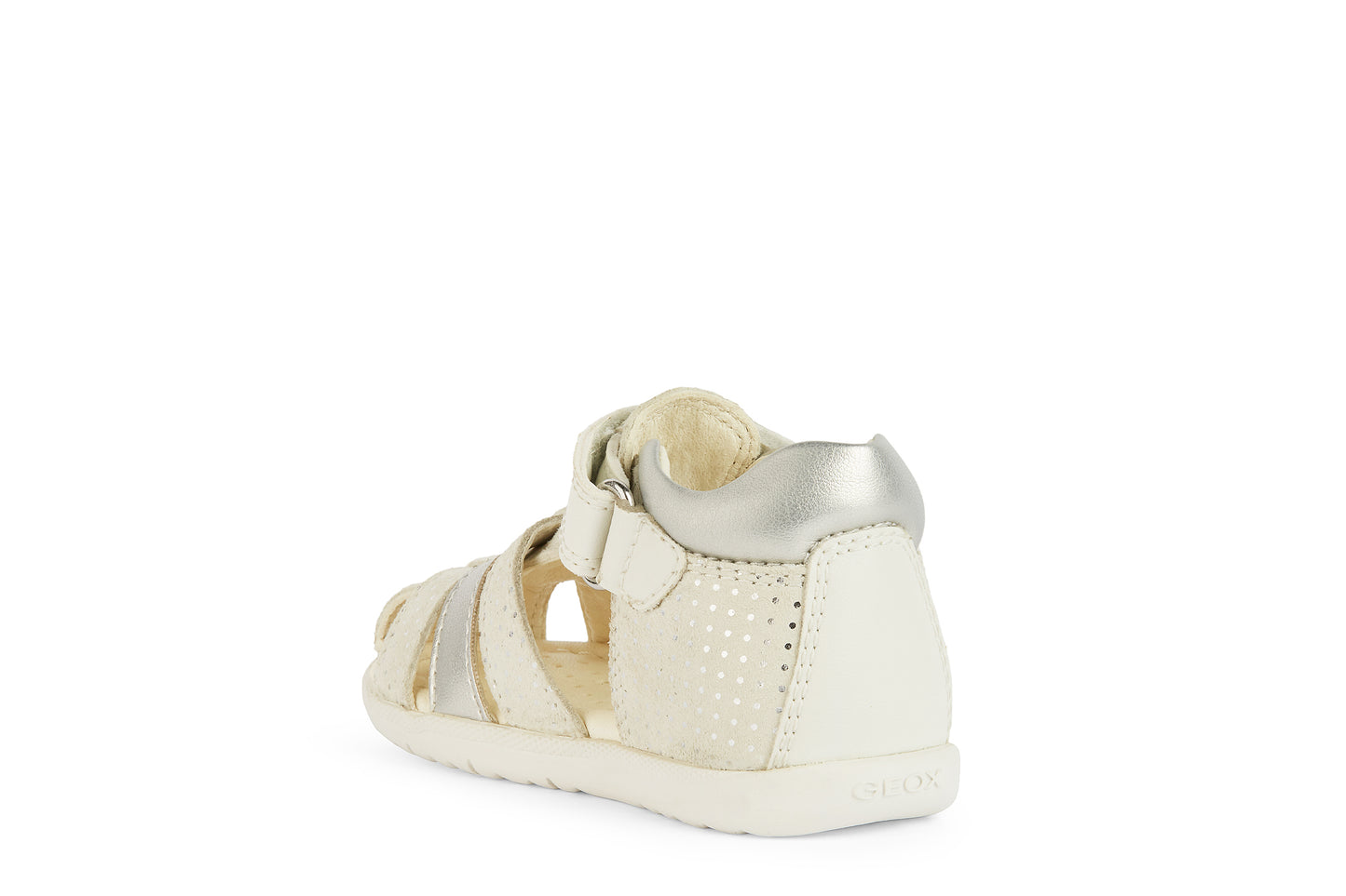 A girls closed toe sandal by Geox, style B Macchia, in off white and spot print silver nubuck leather with velcro fastening. Angled left side view.