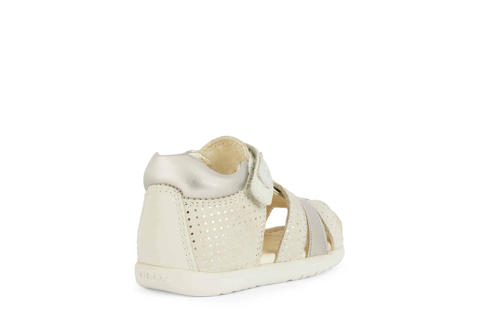 A girls closed toe sandal by Geox, style B Macchia, in off white spot print and silver nubuck leather with velcro fastening. Angled right side view.