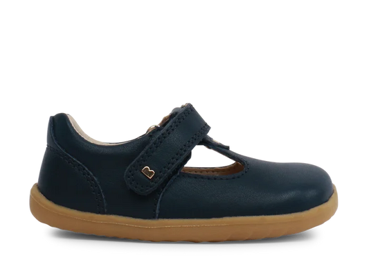 A unisex first shoe by Bobux, style Louise, a velcro T-bar in navy . Side view.