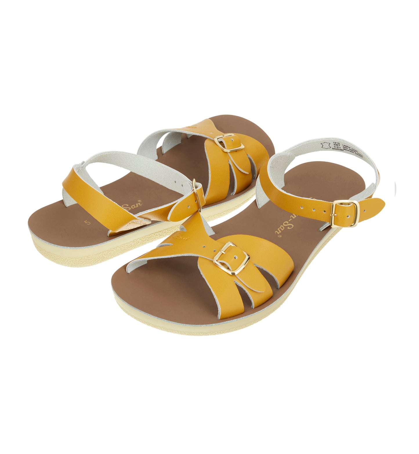 A Boardwalk style girls sandal by Salt Water Sandals in mustard with double buckle fastening across the toes and around the ankle. Open Toe and Sling-back. Top view.