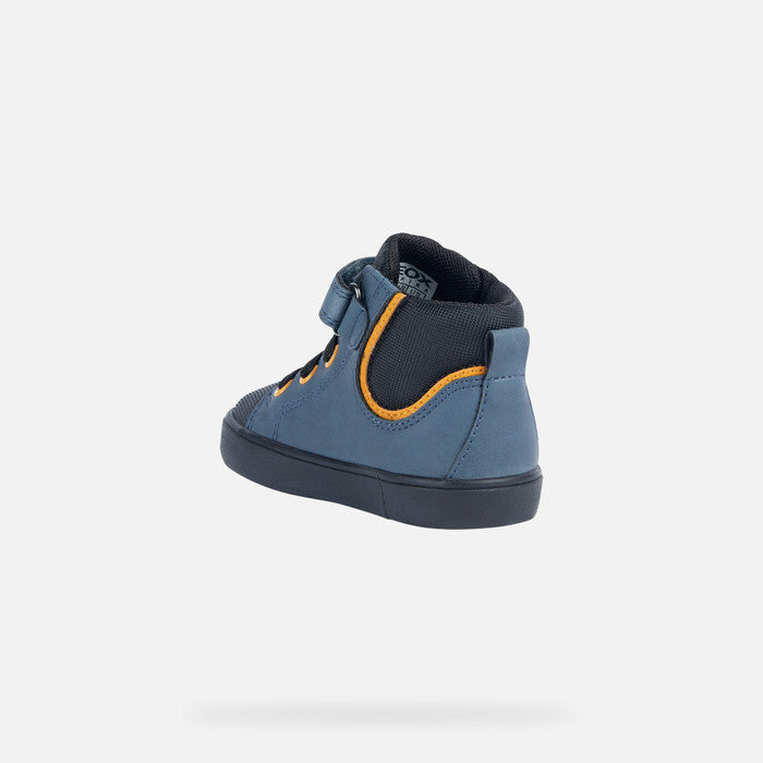 A boys Hi-top by Geox, style B Gisli B, in blue with yellow eyelets and heel trim. Velcro/ bungee lace fastening with rubber toe bumper. Inner side angled view.