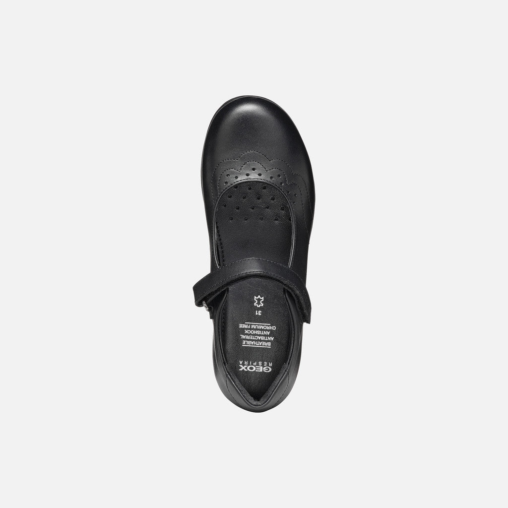 A girls Mary Jane school shoe by Geox, style J46MDI Iberide Girl, in black with punch hole detail and velcro fastening. View from above.