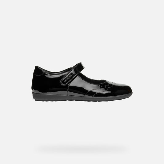 A girls Mary Jane school shoe by Geox, style J46MDG Iberide Girl, in black patent with punch hole detail and velcro fastening. Right side view.