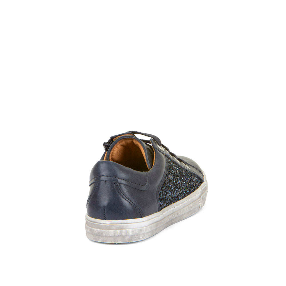 A girls casual shoe by Froddo, style Star G G3130252, in navy leather with side glitter panel and lace fastening. Angled back view.