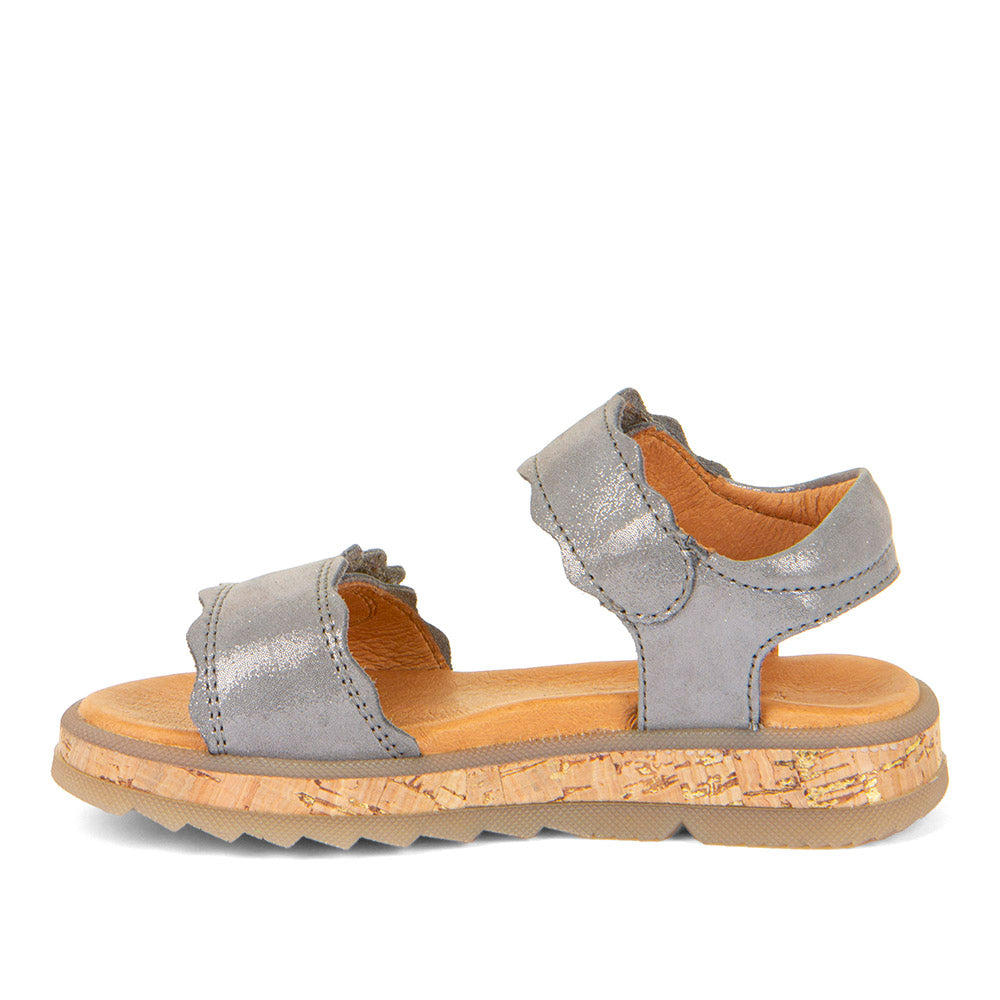 A girls open toe sandal by Froddo, style Alana G3150253-7, in silver leather set on cork effect sole unit with velcro fastening. Left side view.