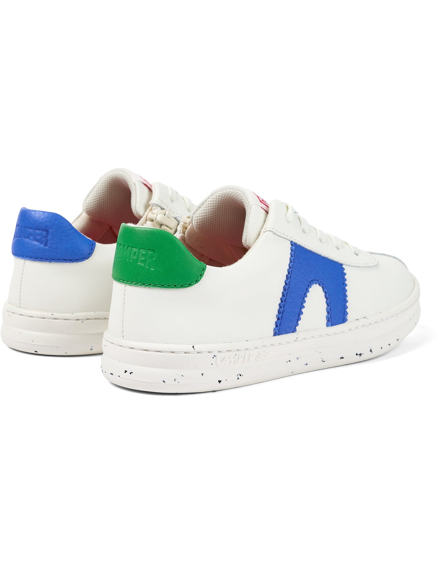 A unisex trainer by Camper, style Twins Kids, in white with asymmetric blue and green detail. Lace/Zip fastening. Rear angled view of a pair.