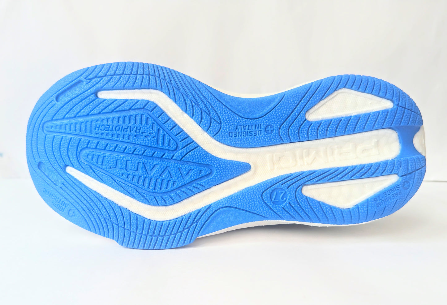 A boys trainer by Primigi, style B&G Rapid 4962511, in navy and blue with elastic lace and velcro fastening. Sole view.