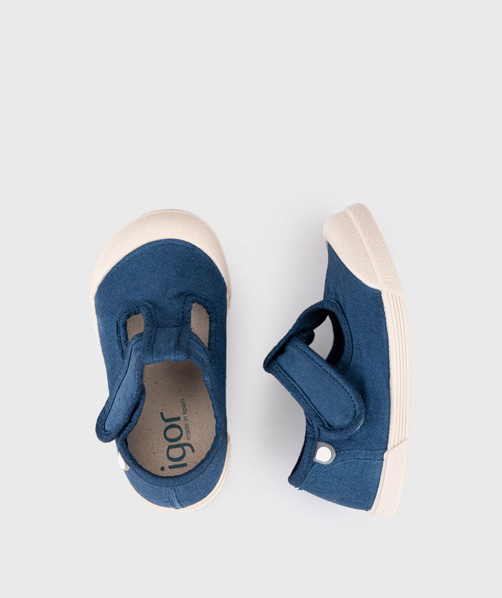 Igor Style Lona Pepito, a T-bar pump in navy with velcro fastening on a cream sole and a toe bumper. Top of a pair view.