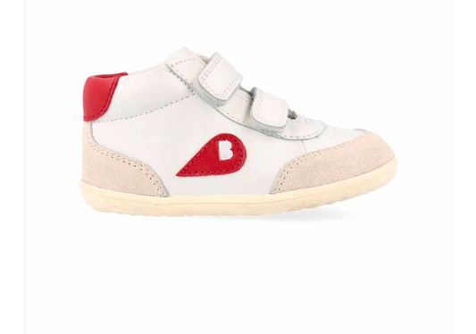 A unisex high top casual boot by Bobux, style Champ, in white with nude and red trim and double velcro fastening. Right side view.