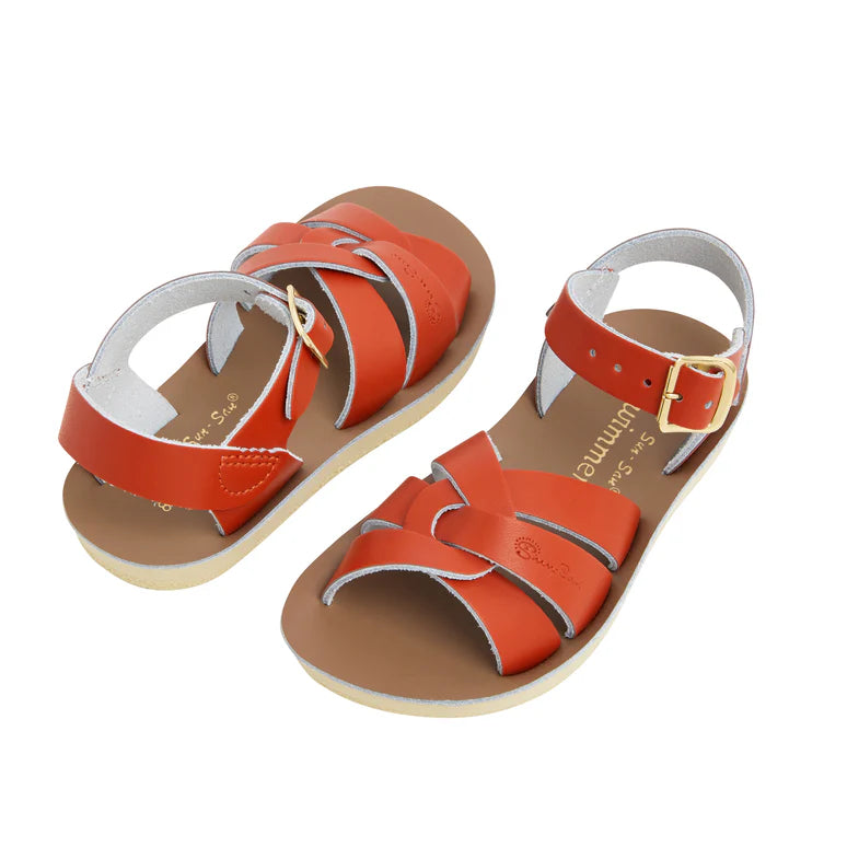 A unisex swimmer design sandal by Salt Water Sandals in paprika with buckle fastening around the ankle. Open Toe and Sling-back with woven detail across the instep. Side by Side view.