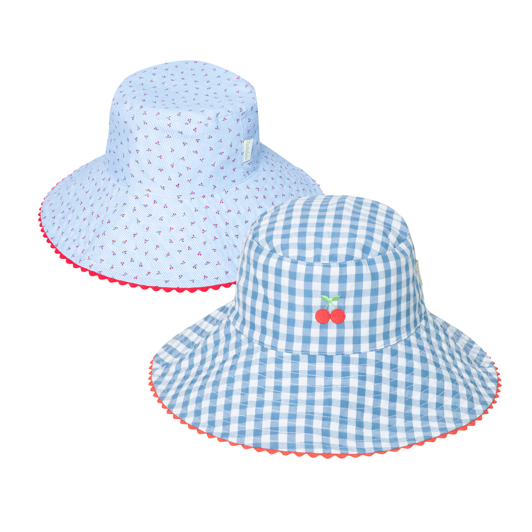 A pair of reversible girls bucket hats by Rockahula, style Cherry Gingham, one side is blue and white with red cherry stripe print,the other blue and white gingham with cherry embroidery. Front view. 