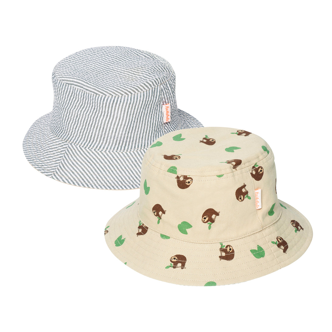 A pair of revirsable children's hats by Rockahula, style Sleepy Sloth, in beige with sleepy sloth print on one side and green stripe print on the other. Front view.