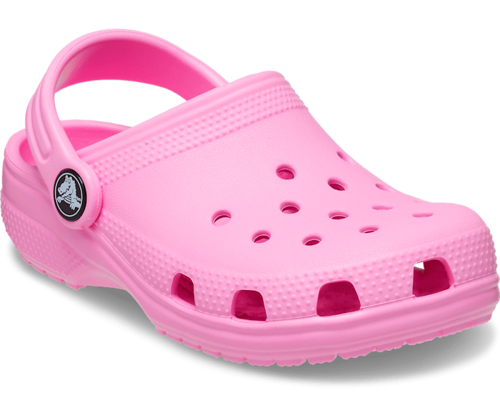 A girls classic clog by Crocs, style Todd in pink. Right angled view.