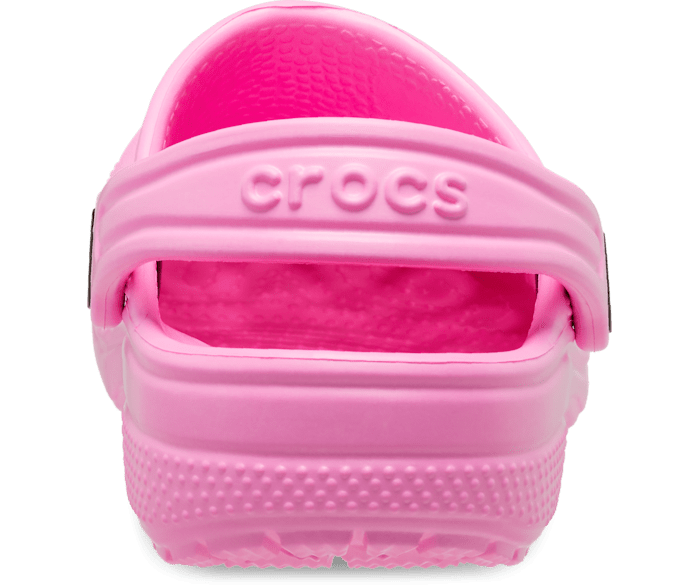 A girls classic clog by Crocs, style Todd in pink. Right view of back.