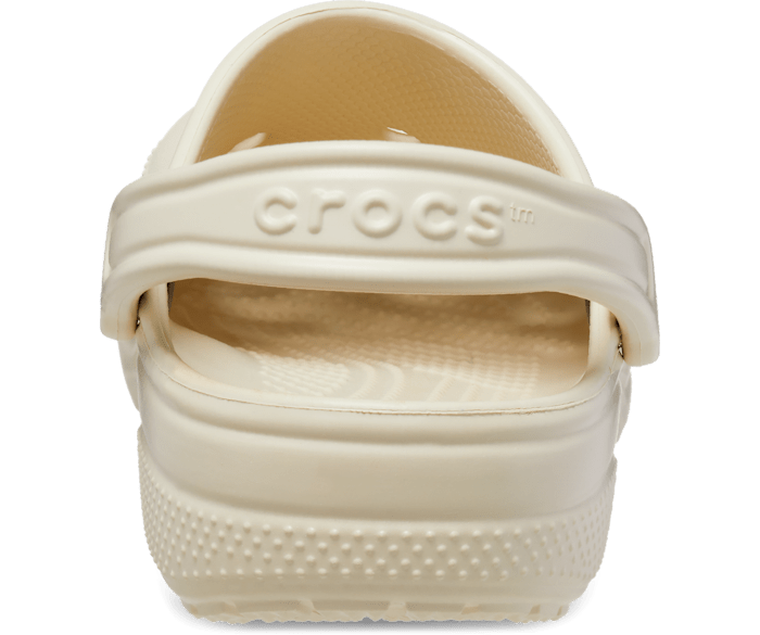 A unisex classic clog by Crocs, style Todd in bone. View of the back.