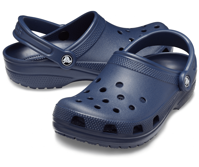 A unisex classic clog by Crocs, style Todd in navy. Right side view, left angled view.