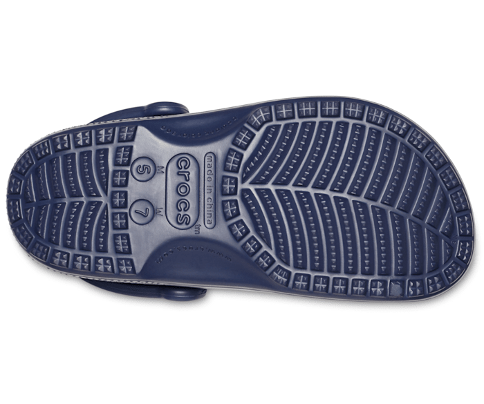 A unisex classic clog by Crocs, style Todd in navy. View of right sole.