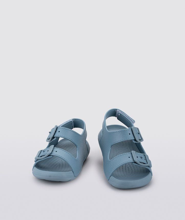 A boys sling back rubber shoe by Igor, style Maui in blue with two buckle straps and velcro heel fastening. Front pair view.