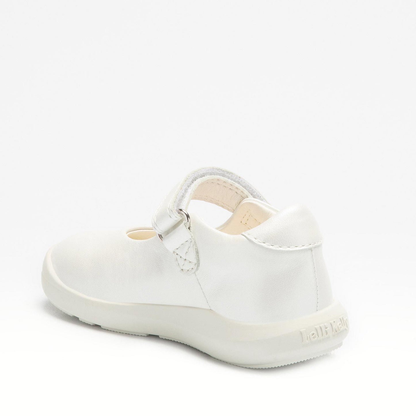 A girls Mary Jane shoe by Lelli Kelly, style MXBA4120 Kayla, in white with heart detail to sole and velcro fastening. Angled view of left side.