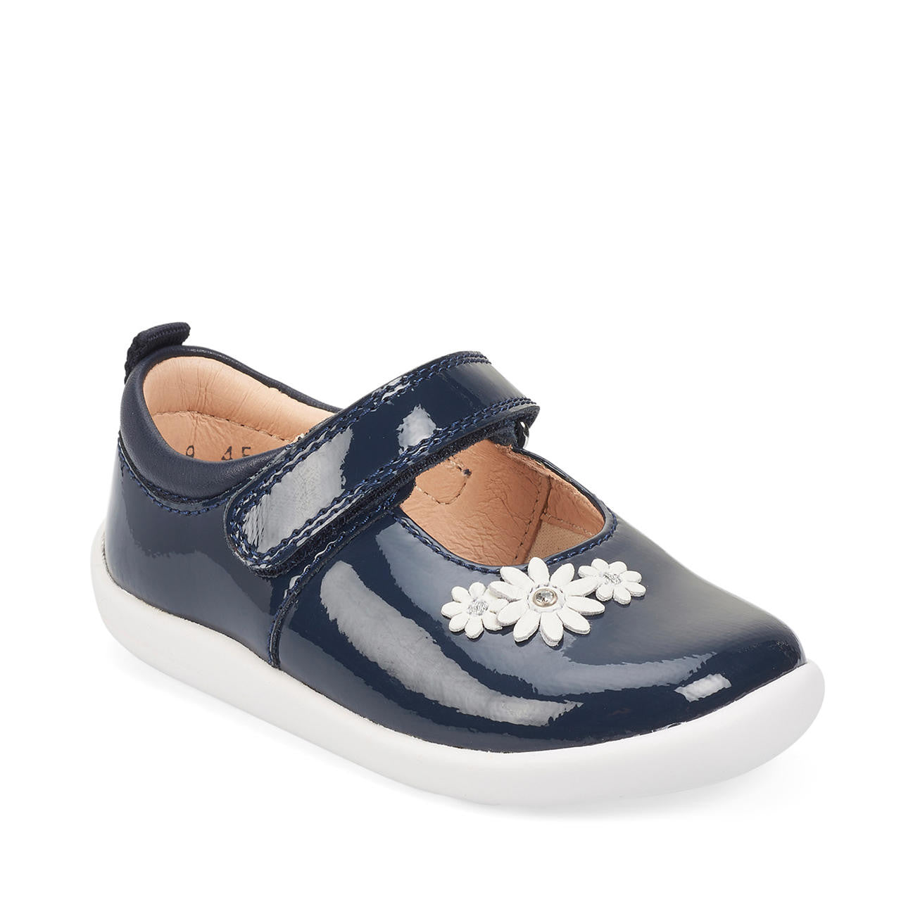 A girls Mary Jane shoe by Start-Rite, style Fairy Tale, in navy patent leather on white sole unit with white flower and diamante detail. Velcro fastening. Angled right side view.