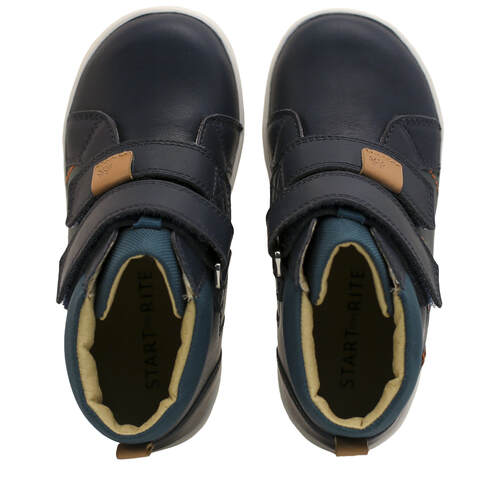 A pair of boys casual boots by Start-Rite, style Discover, in navy leather with white sole and double velcro fastening. Above view.