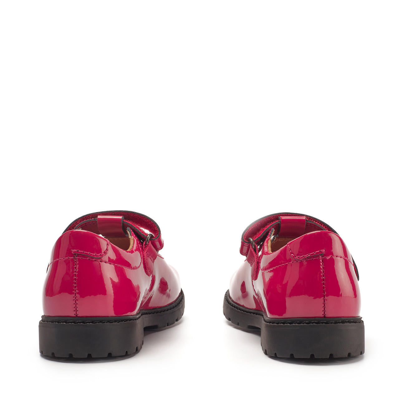 A pair of girls T-Bar shoes by Start-Rite, style Liberty, in red patent with velcro fastening. Back view.