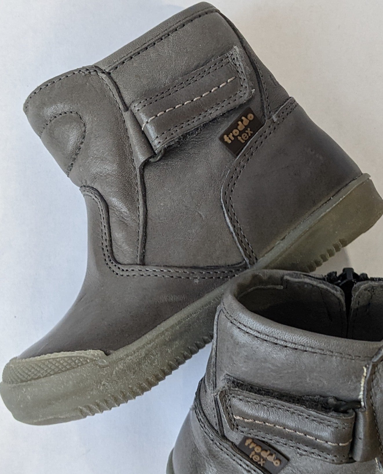 A boys waterproof ankle boot by Froddo, style G2160034-1 , in grey leather with toe bumper. Angled view of pair.