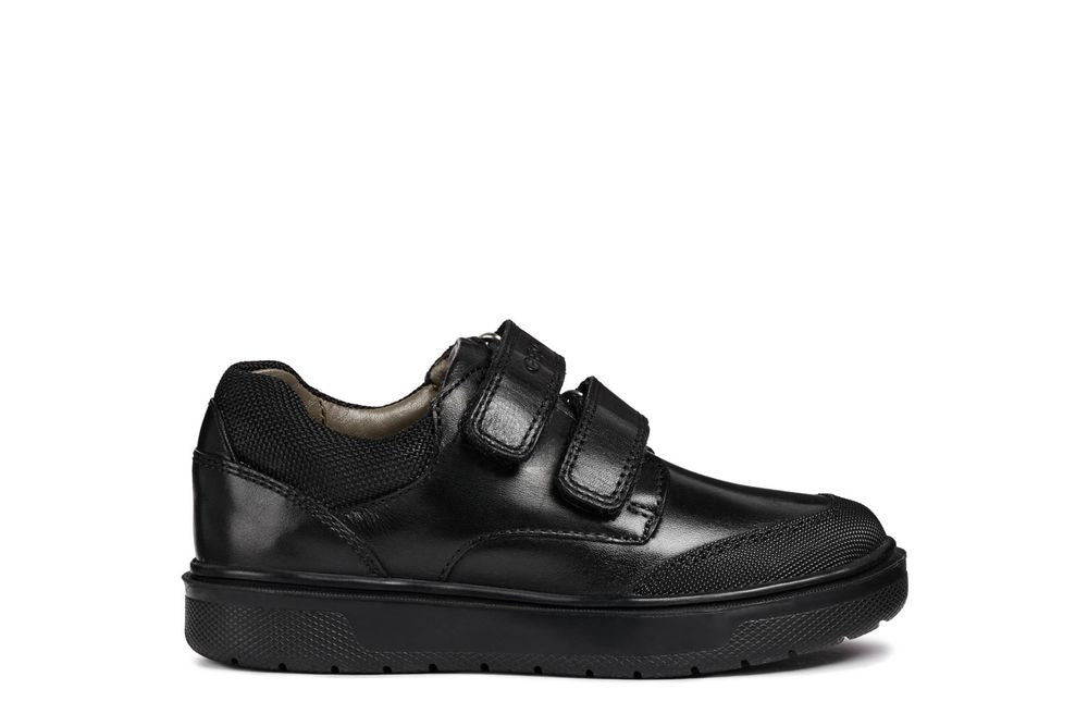 A boys smart school shoe by Geox, style Riddock,in black with double velcro fastening. Right side view.