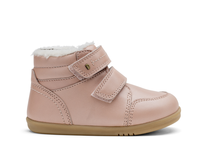 A girls waterproof fur lined ankle boot by Bobux,style Timber, in pale pink with double velcro fastening. Right side view.