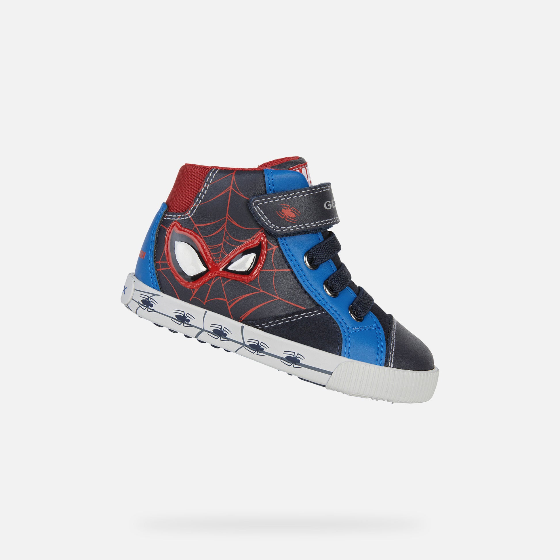 A boys Hi-Top trainer by Geox, style B Kilwi Boy Spiderman, in navy and royal with red Spiderman detail, velcro and inside zip fastening. Right side view.